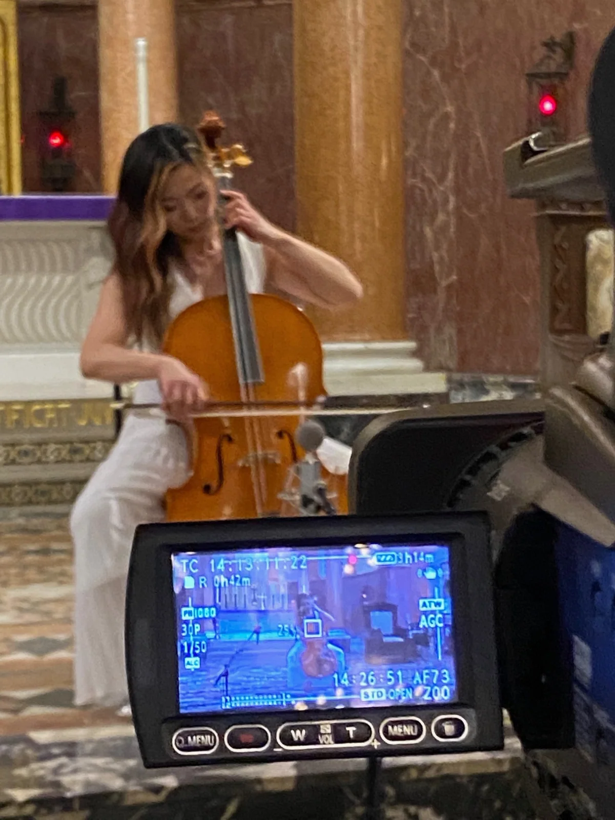 Cellist filmed during a performance