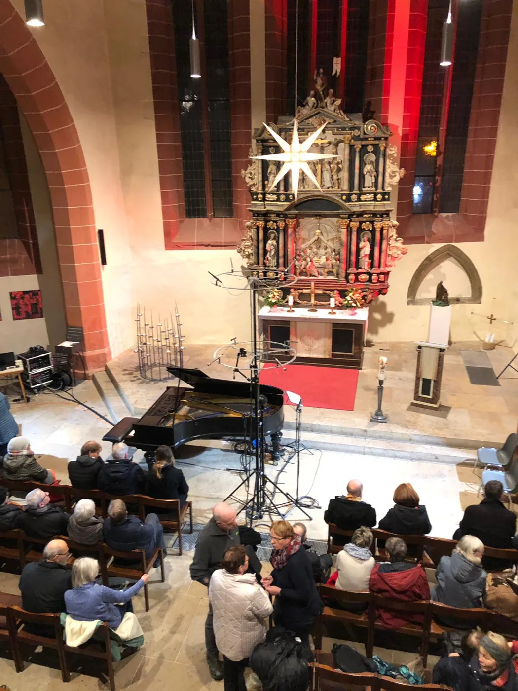 Recording and performance in a church with listeners gathered nearby